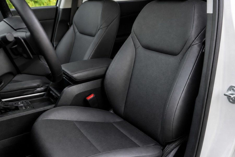 Automotive seat with heating pad and lumbar support cable routing